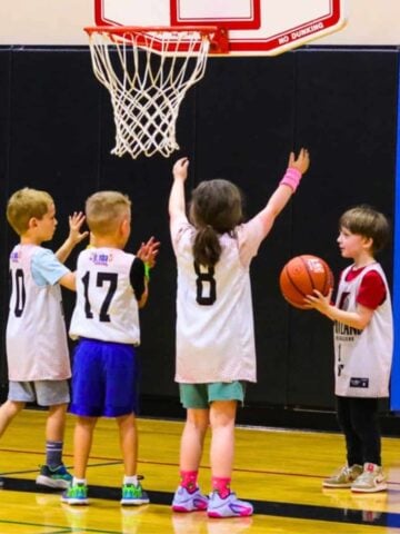 Kat and John playing in a Jr. NBA/YMCA youth basketball game