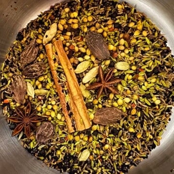 black masala spices in a saucepan