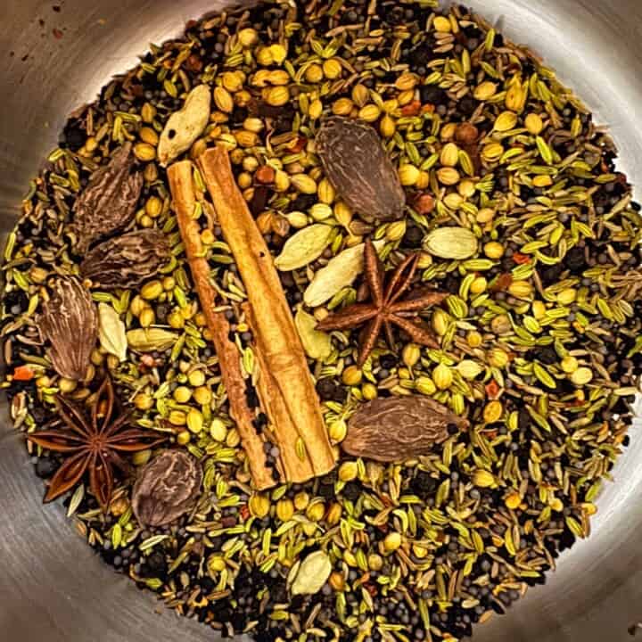 black masala spices in a saucepan