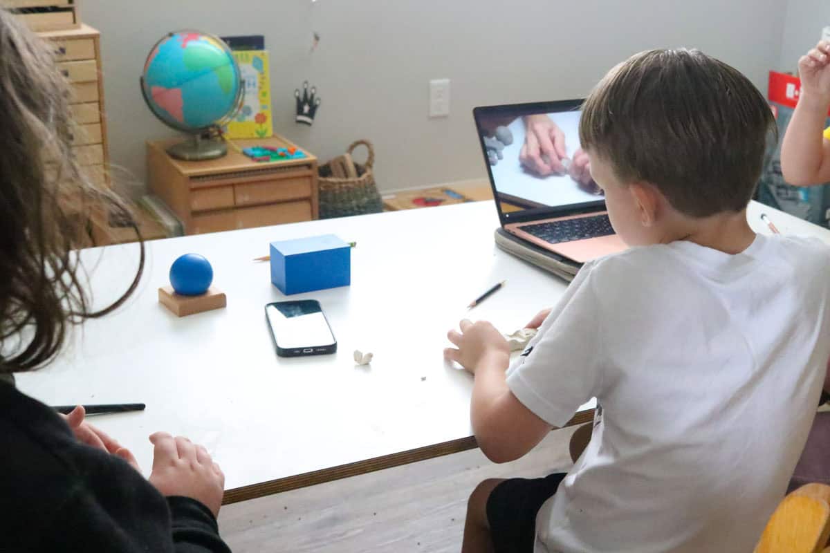 the kids are watching a tutorial and making a sports car
