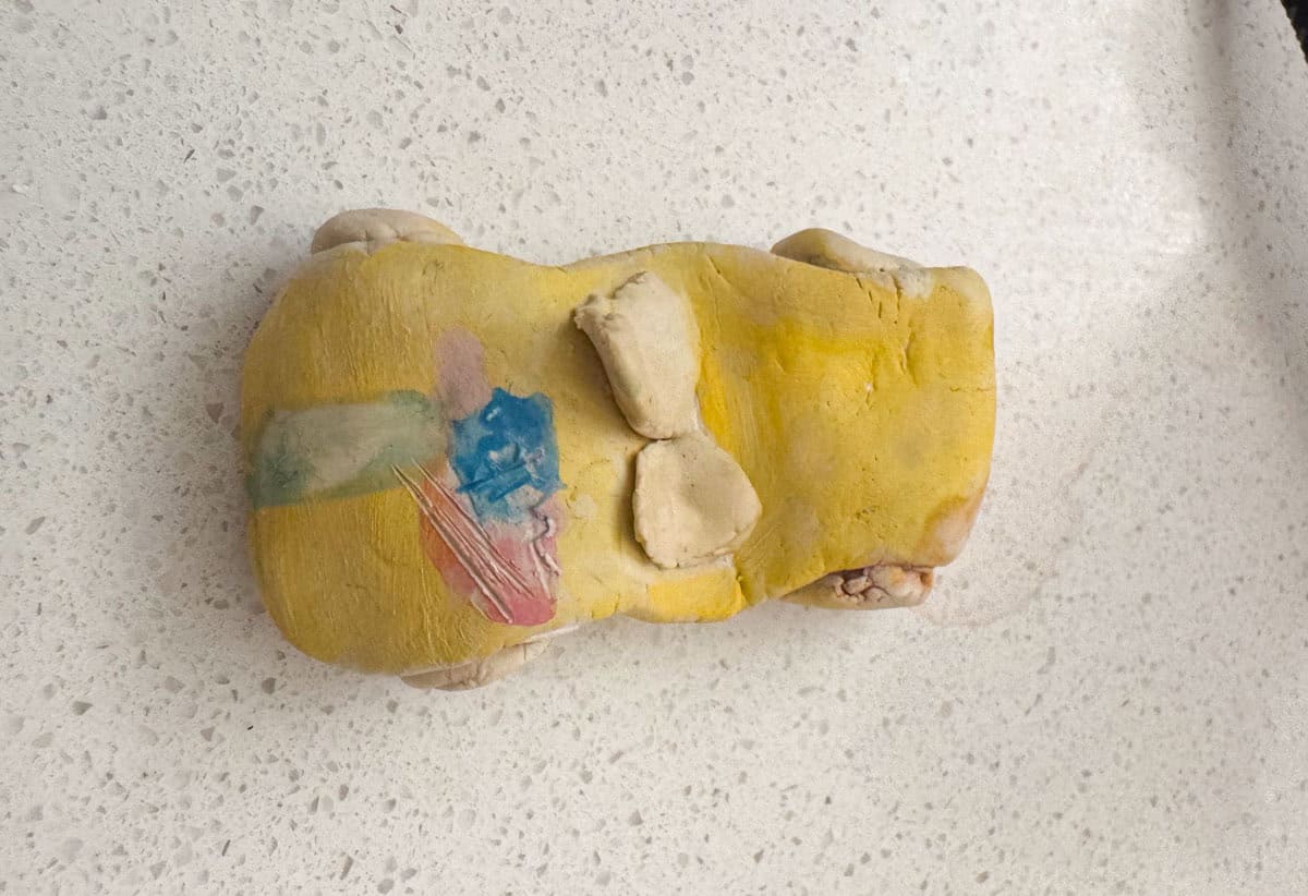 yellow clay sports car with an American flag on the back, made by Kat