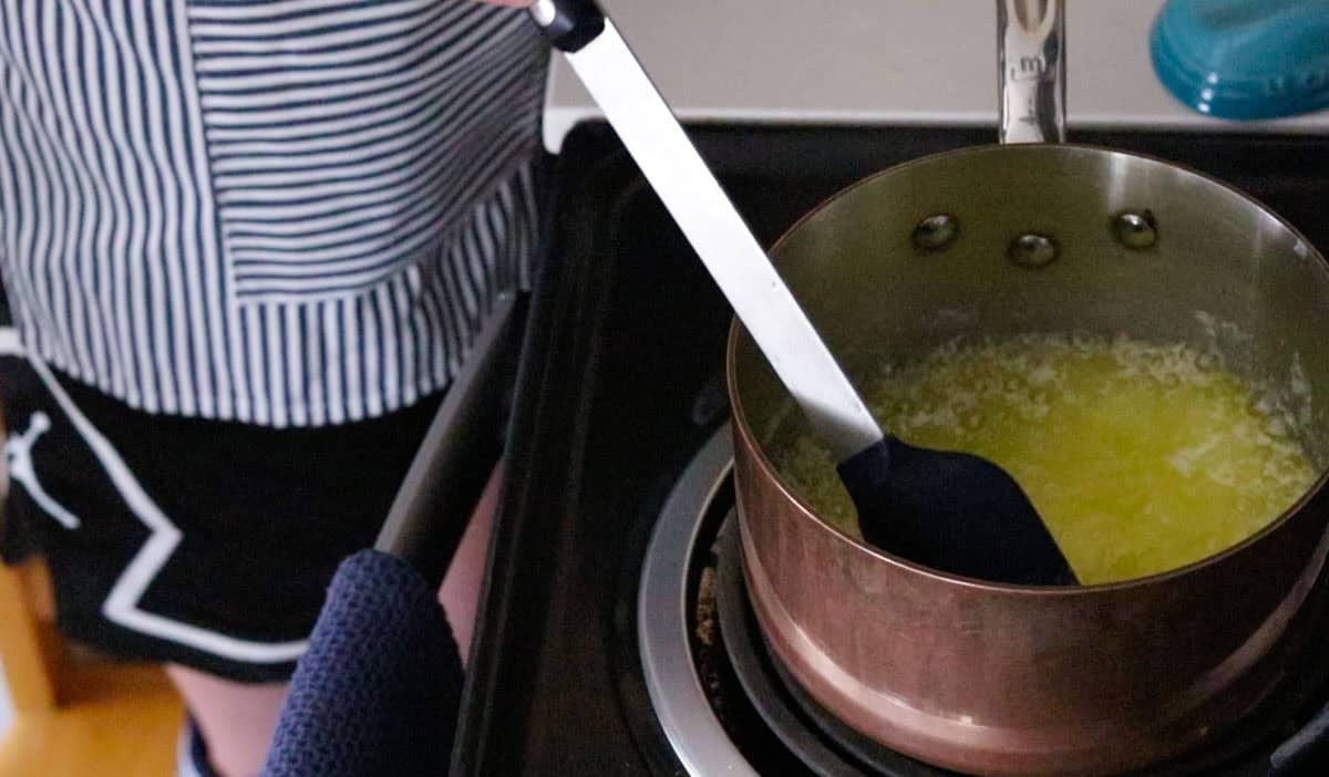 Kat is stirring melted butter