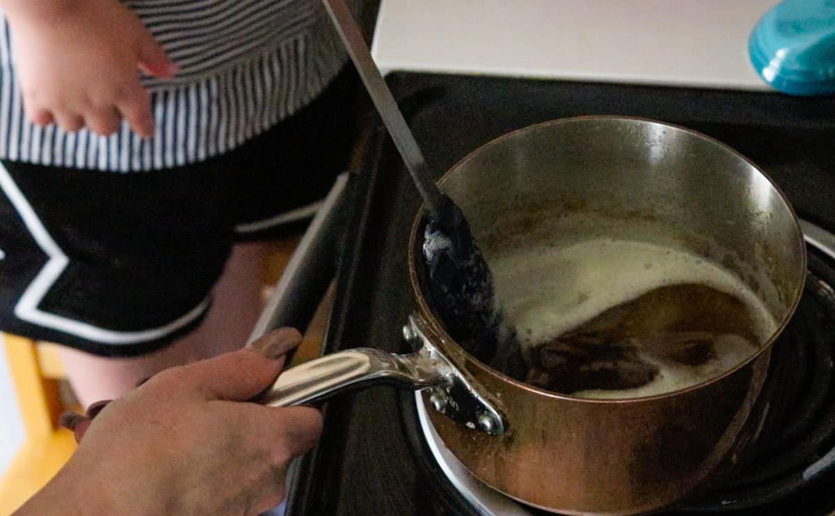 making golden butter at the stove