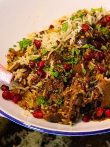 lamb biryani with black masala and figs plated