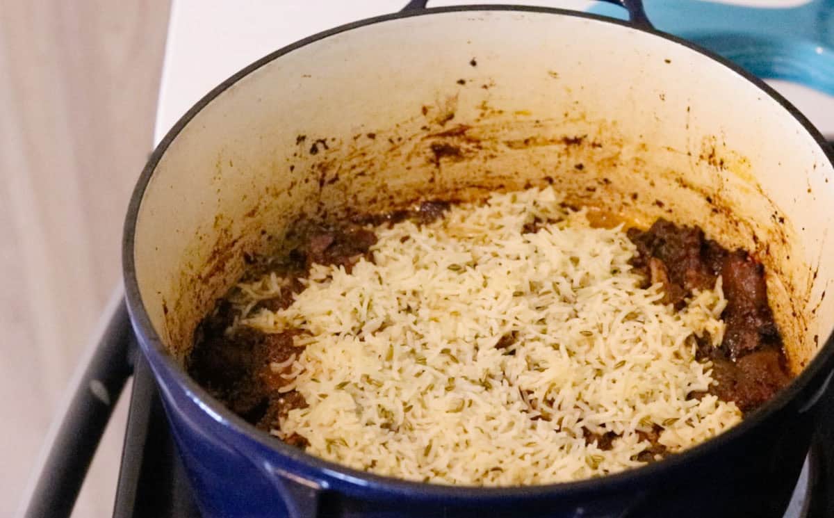 lamb biryani with black masala and figs in a Dutch oven