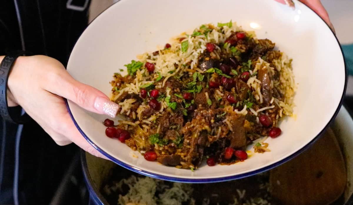 lamb biryani with black masala and figs plated