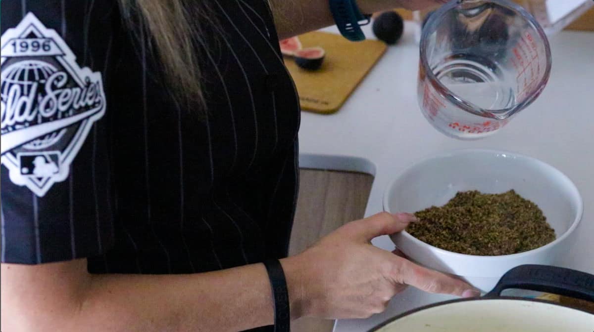 adding water to black masala