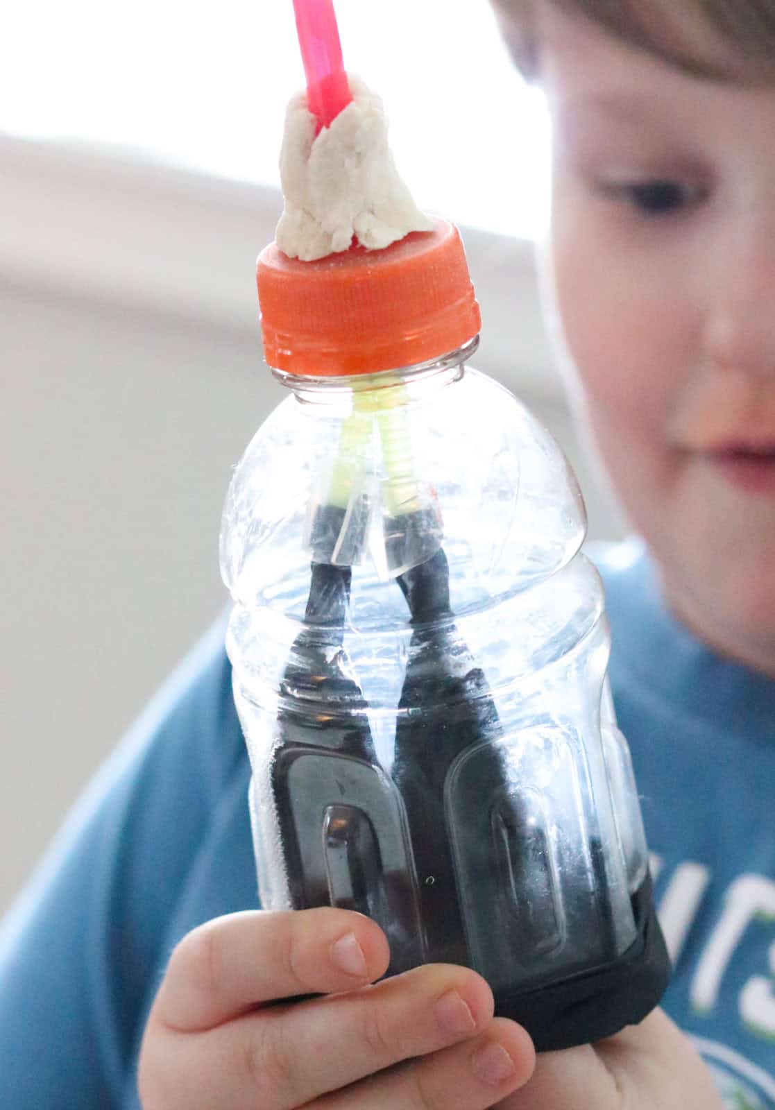 Noah is manipulating the 'diaphragm' of a working lung model