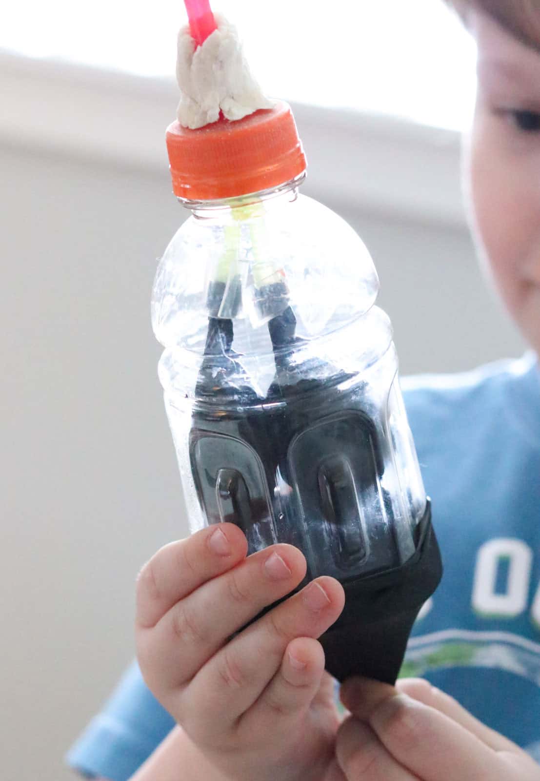 Noah is inflating the 'lungs' on a working lung model