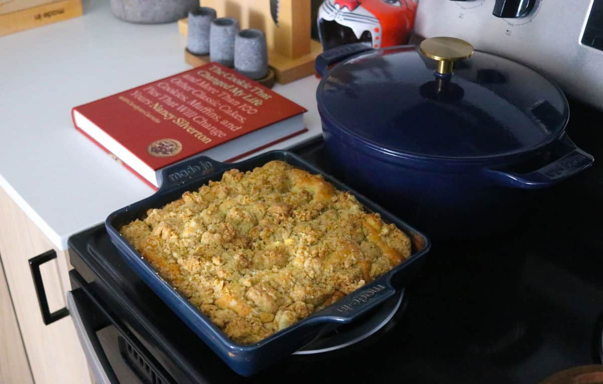 New York Crumb Cake in a square baking dish beside The Cookie That Changed My Life
