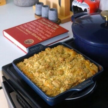 New York Crumb Cake in a square baking dish beside The Cookie That Changed My Life