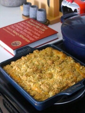 New York Crumb Cake in a square baking dish beside The Cookie That Changed My Life