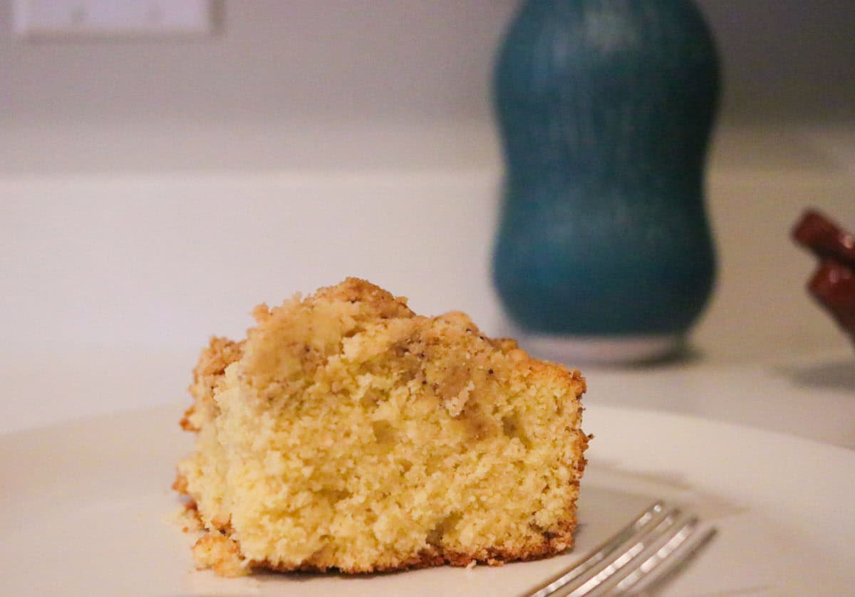 a small slice of crumb cake on a plate