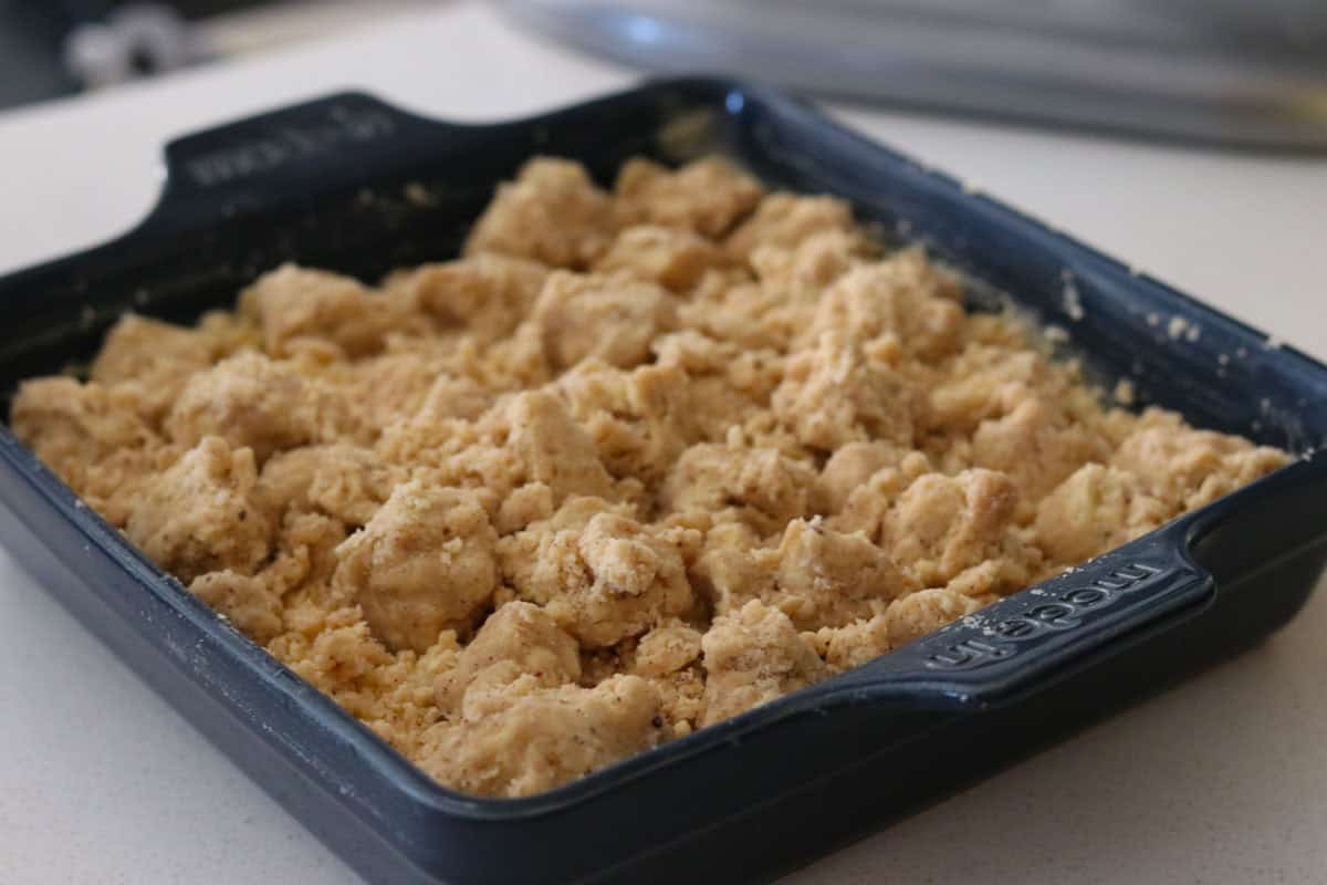 unbaked new york crumb cake in a square baking dish