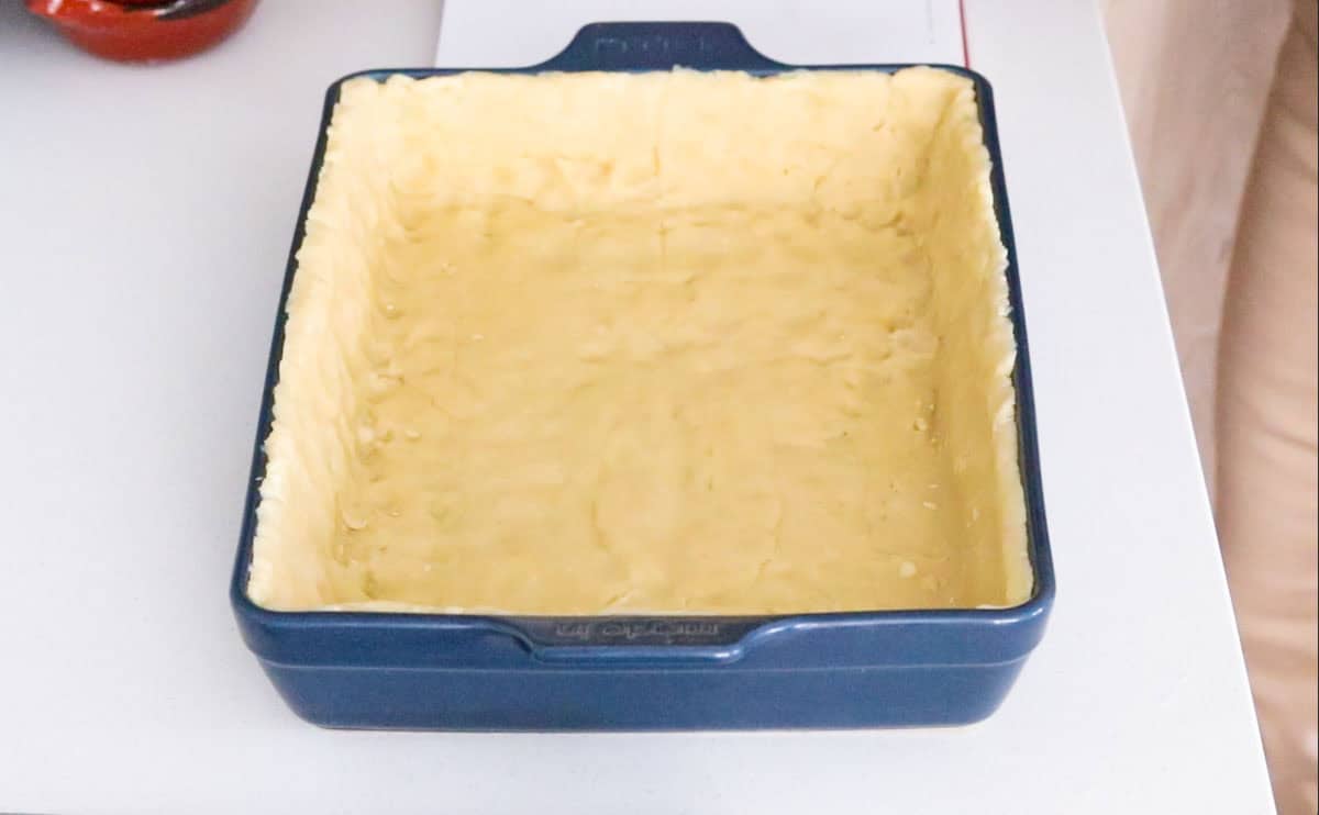 quiche tart dough in a rectangular baking dish