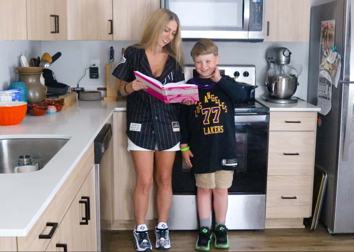 Kristin and Noah are reading the lamb biryani recipe from Mother Tongue