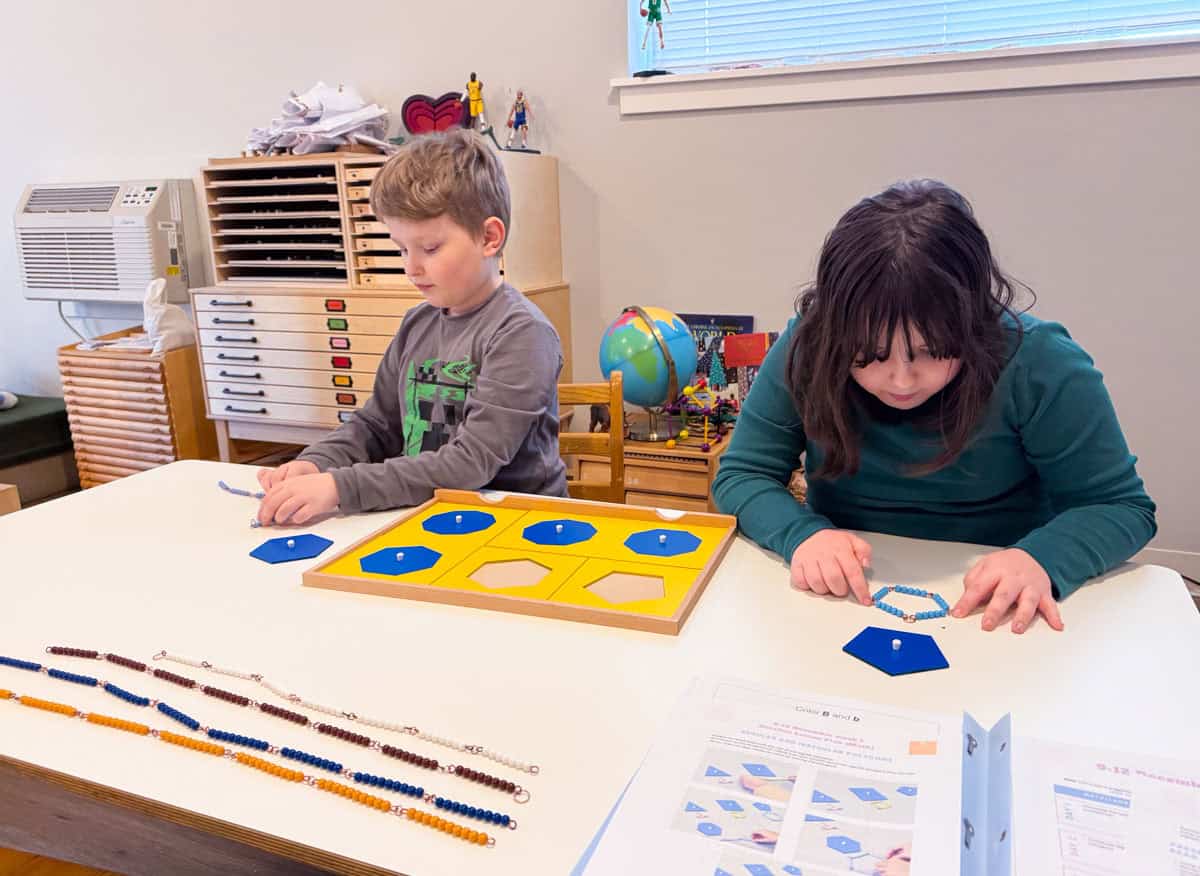 Kaia and Noah are building polygons using bead chains and using the polygon drawer from the Montessori geometry cabinet