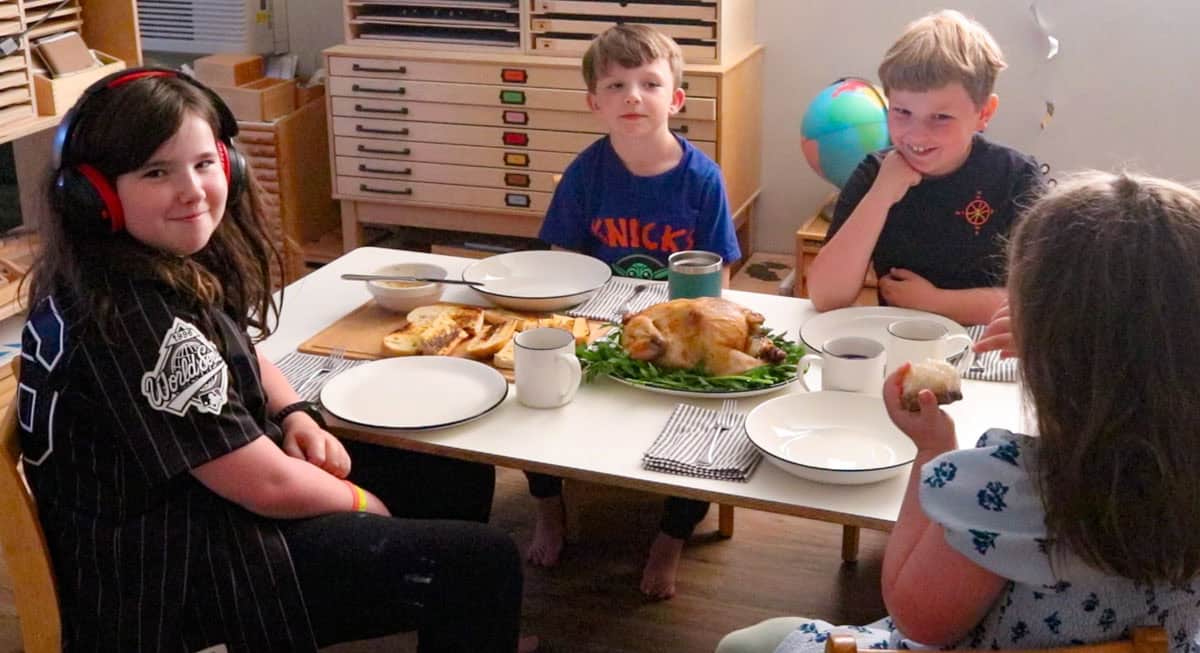 the kids are seated for the roasted chicken dinner