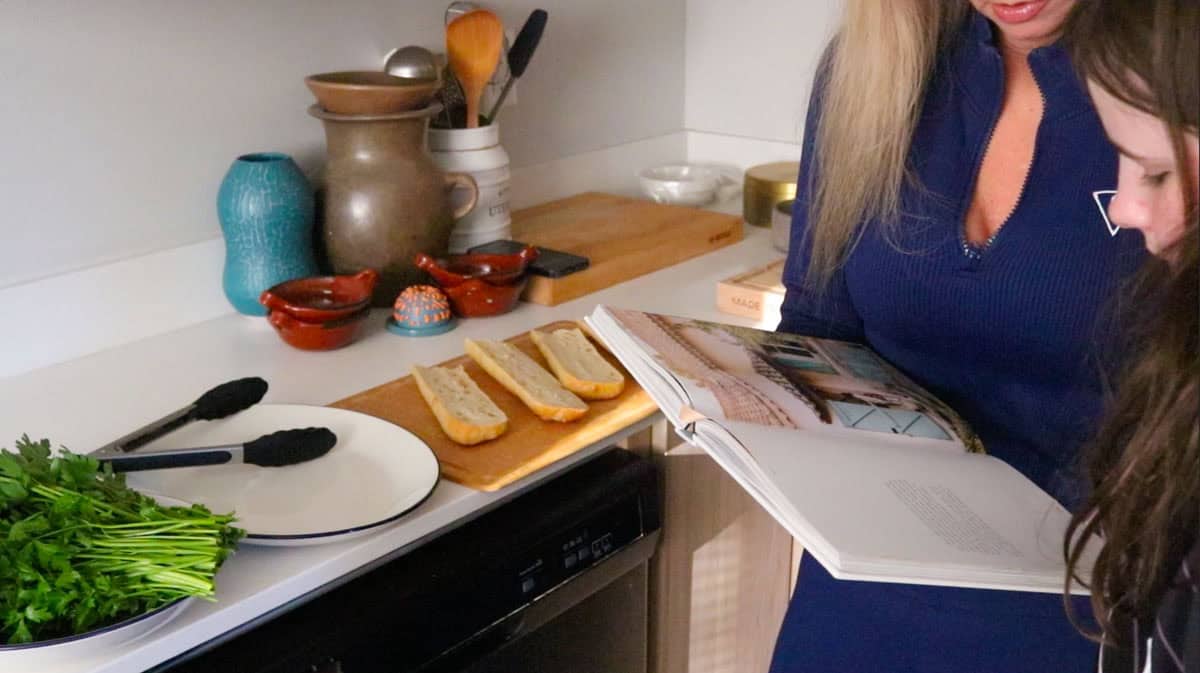 Kristin and Kaia are reading Le Sud cookbook