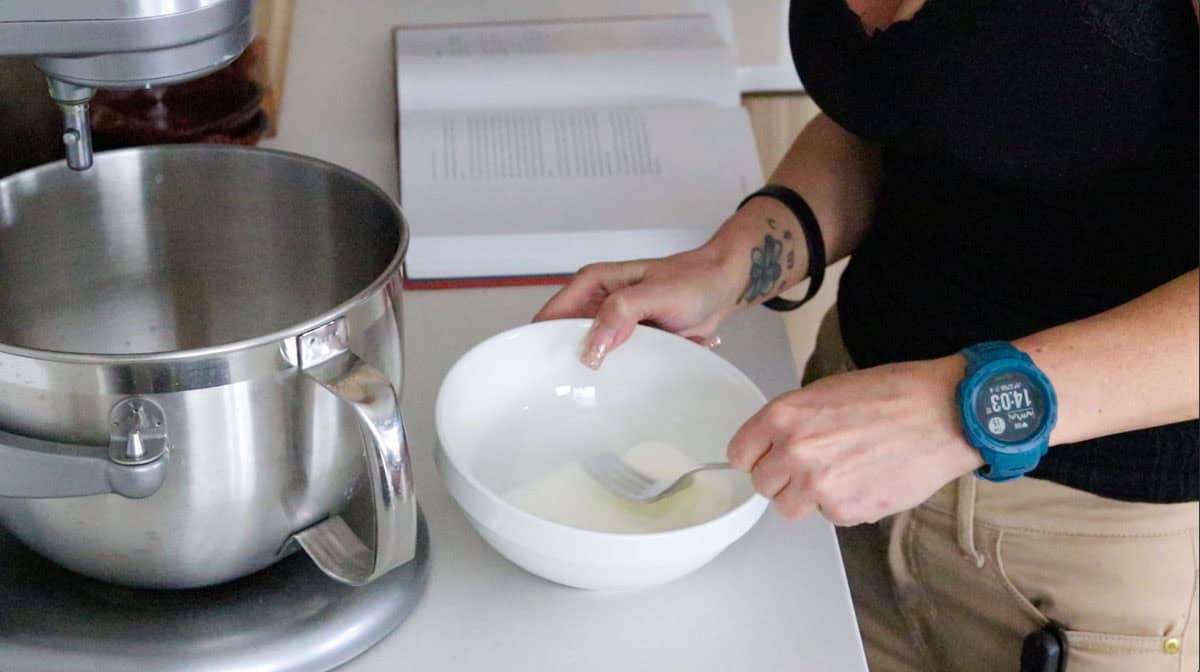 Kristin is whisking cream and water
