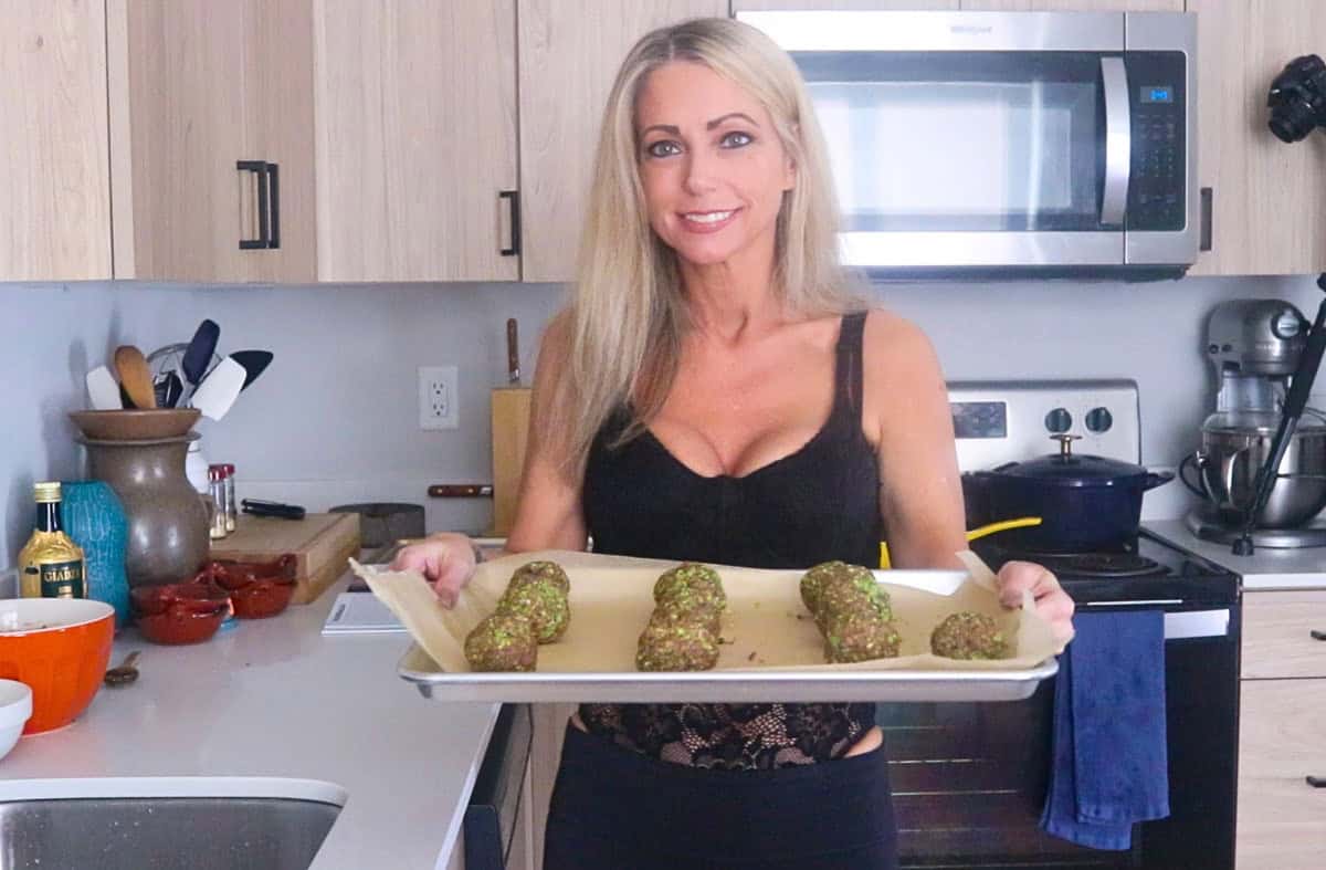 Kristin is holding a tray of meatballs