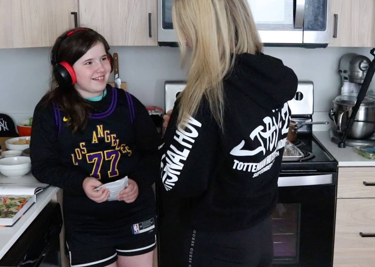 Kaia and kristin are chatting in the kitchen
