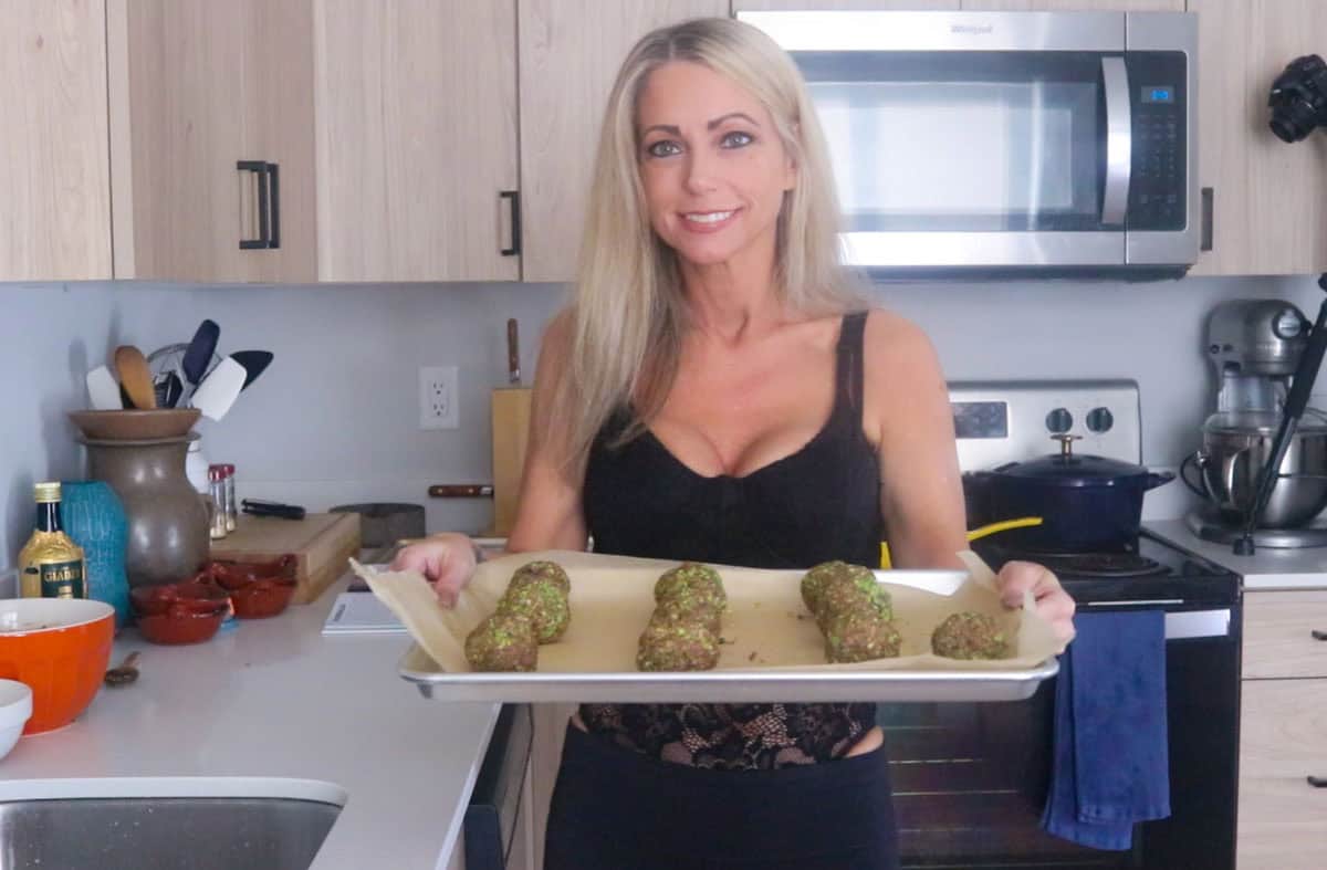 Kristin is holding a tray of meatballs