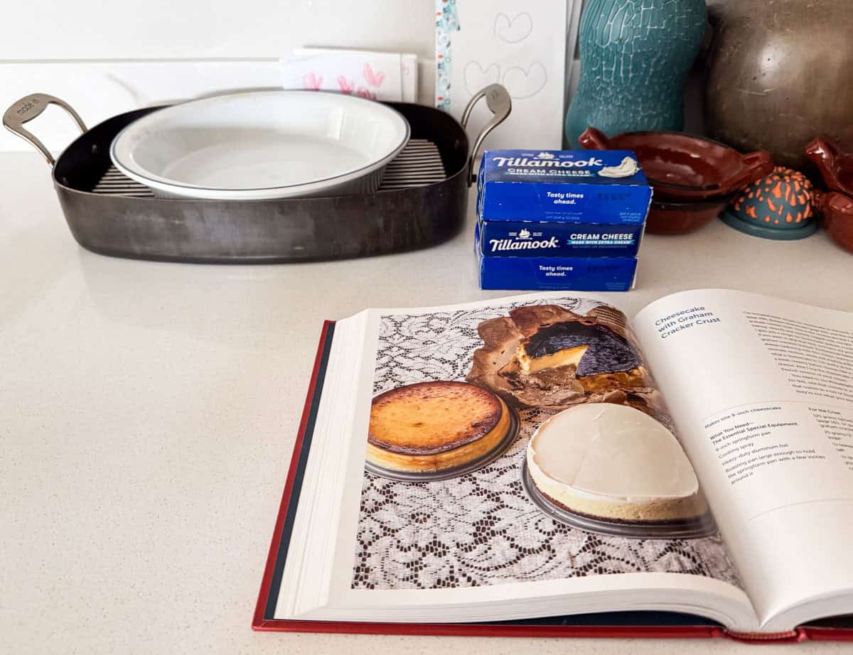 a pie dish in a roasting pan, tillamook cream cheese, and 3 dfferent cheesecakes from The Cookie That Changed My Life