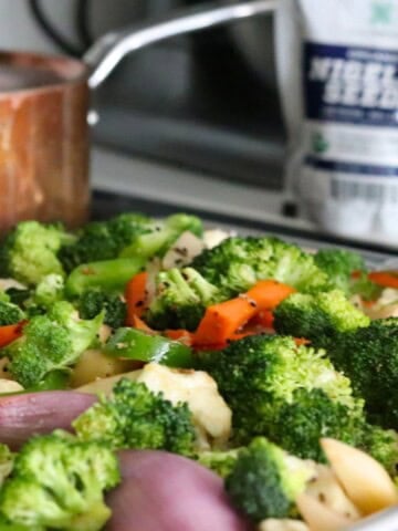 nigella-spiced roasted vegetables on a baking sheet