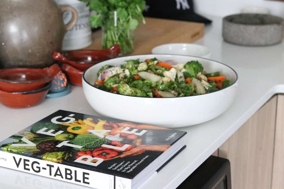 nigella-spiced vegetable medley in a serving bowl beside Veg-Table